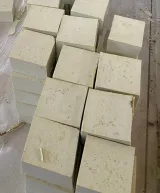 Hand-cut ivory olive oil soap bars stacked in rows, unwrapped